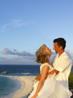 Wedding kiss atop the cliff view of Dragon Cay